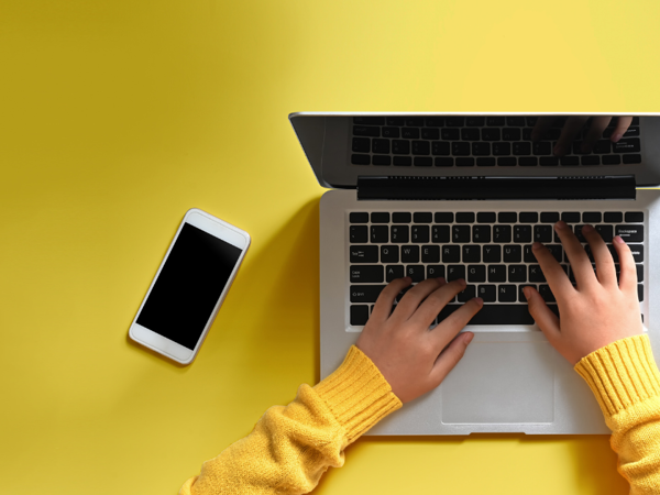 Person using smartphone or laptop